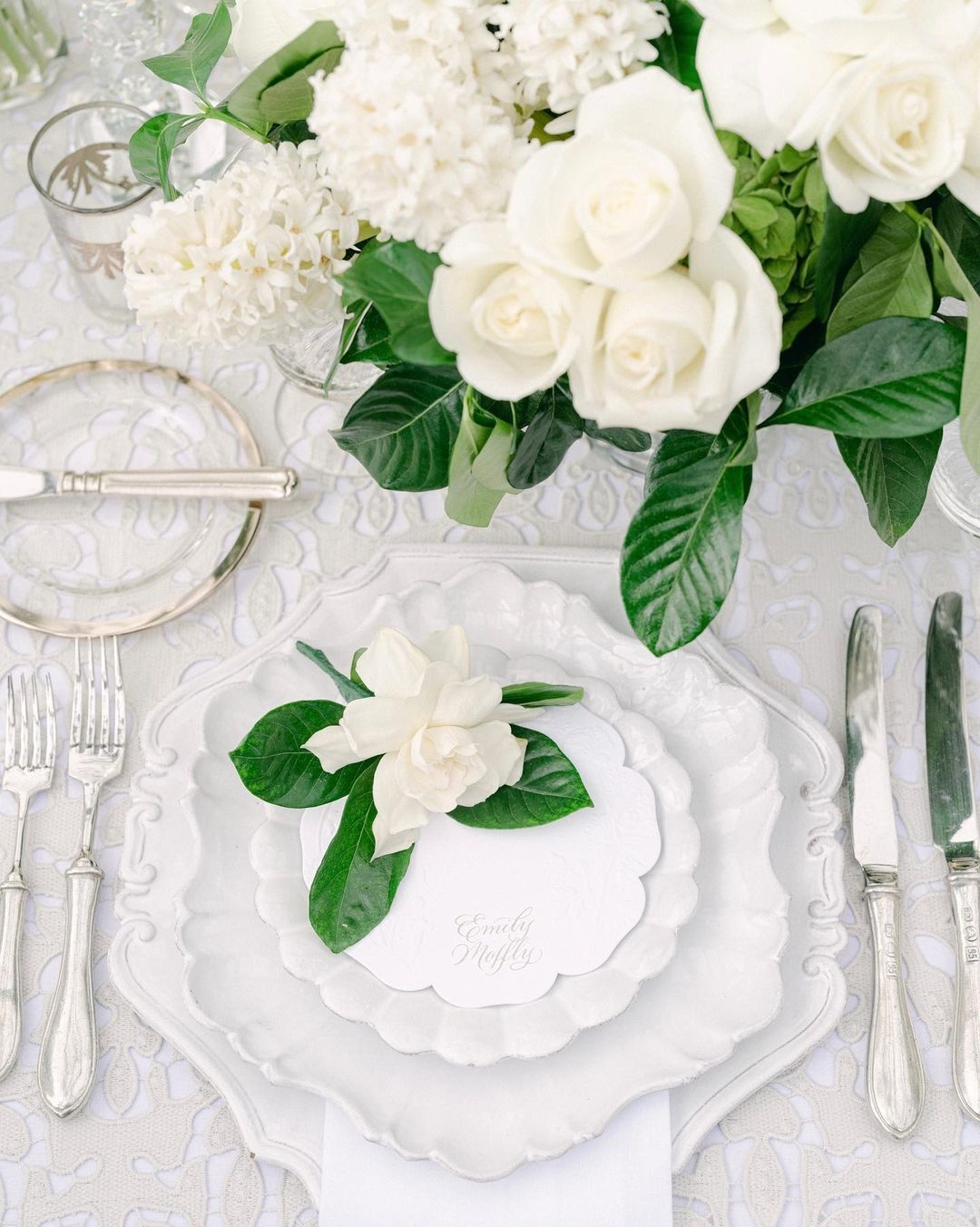 A table place setting with floral display